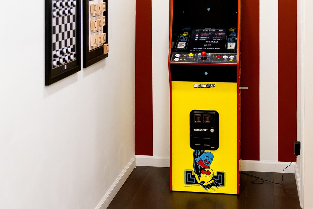 Retro Pac-Man arcade machine in the cabin's game corner