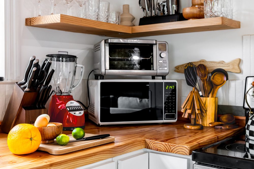 Kitchen with butcher-block counters, cookware and everyday cooking essentials