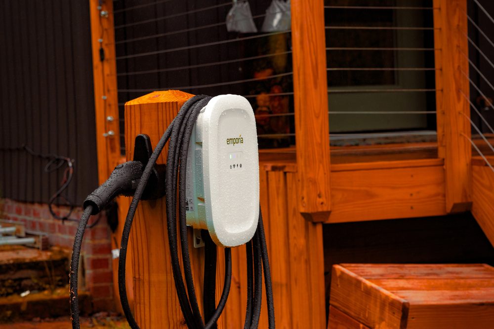 Electric vehicle charger at the cabin's parking area