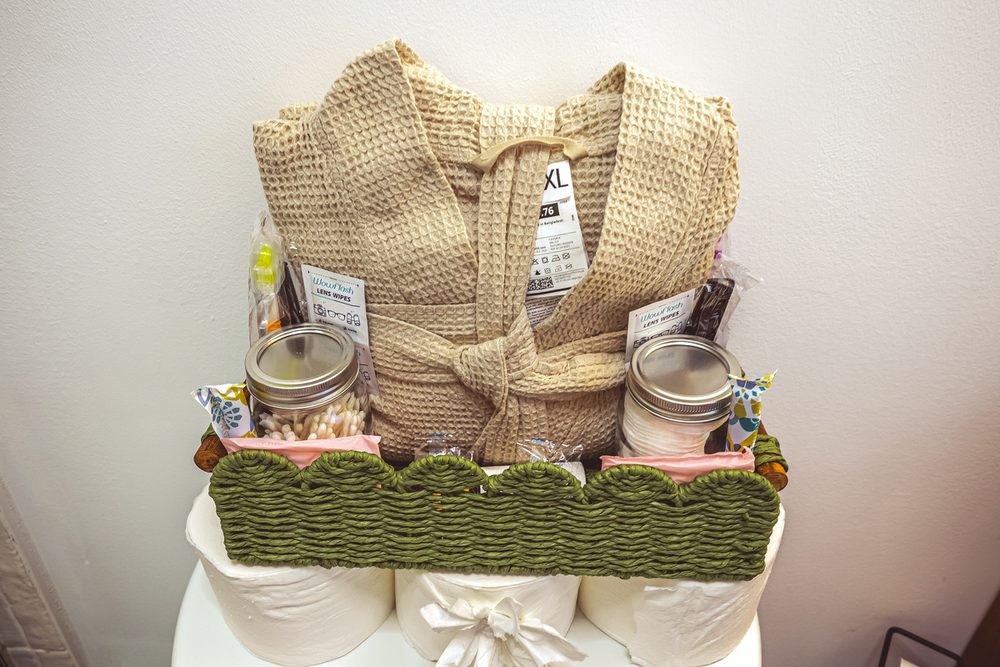 Waffle robes and toiletries laid out for arriving guests