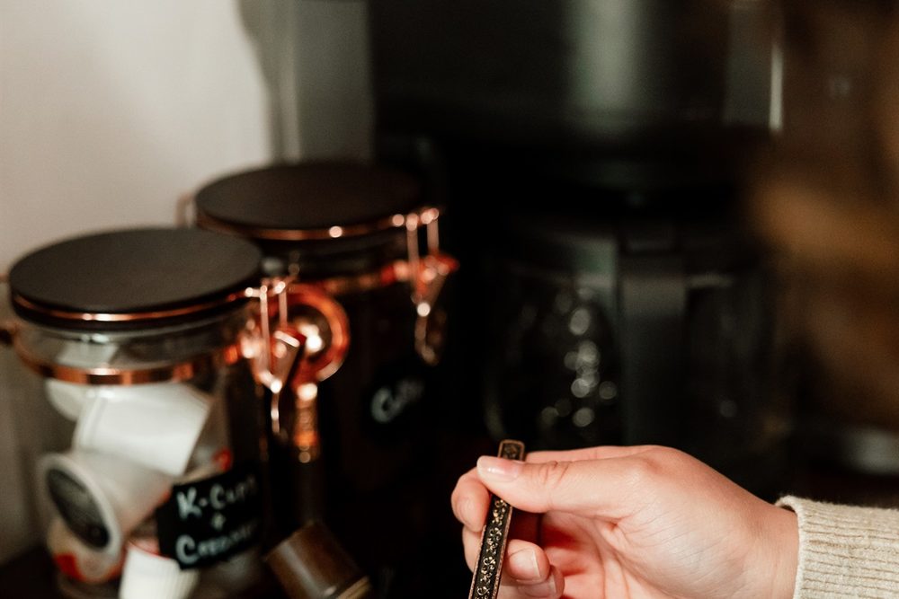 Espresso machine pulling a shot on the coffee station