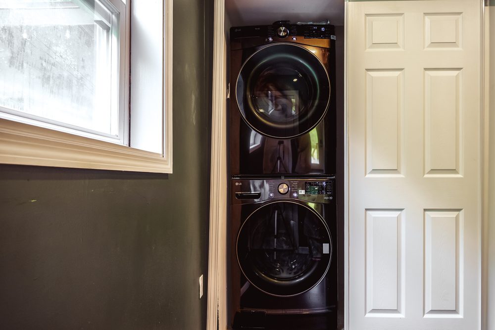 Washer and dryer with laundry shelf